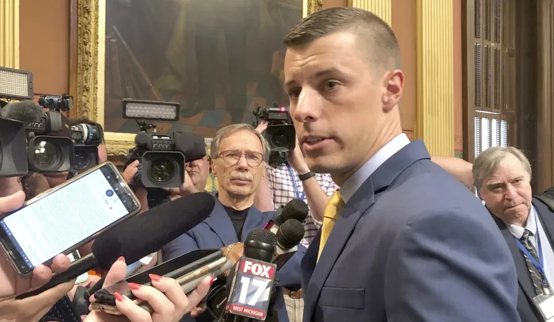 Two people who worked for former Michigan House leader are charged with financial crimes