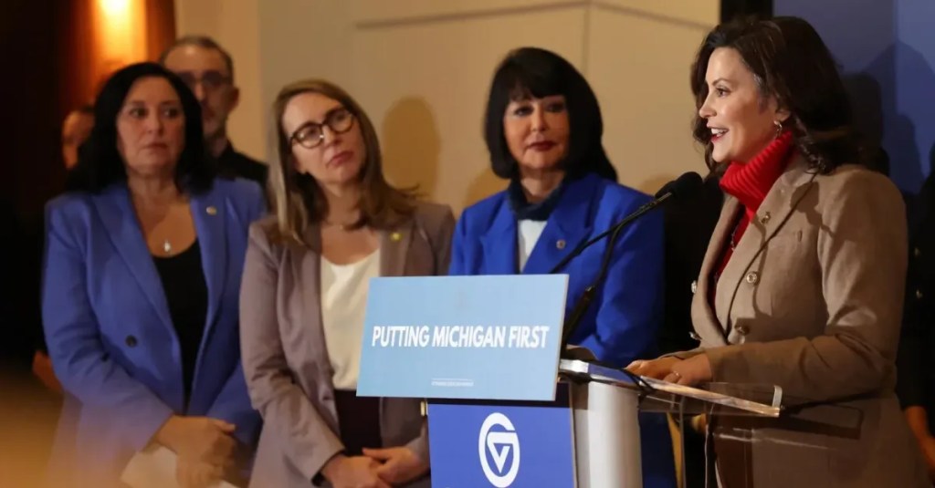 Whitmer signs bills to pay off school debt and fund roads