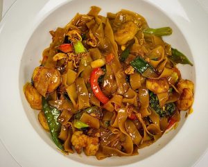A bowl of drunken noodles.