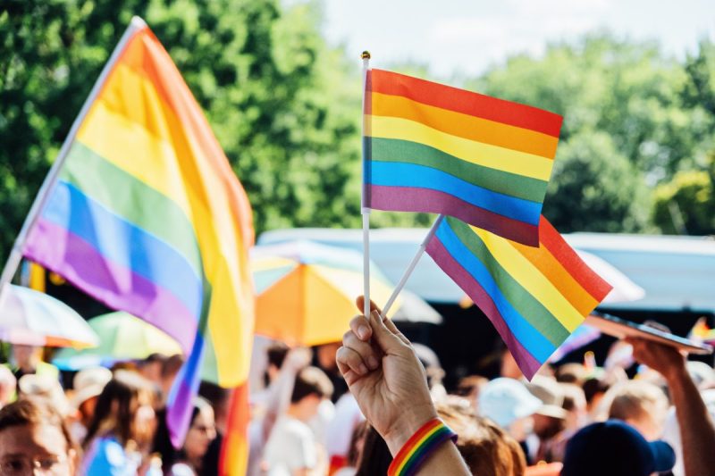 PRIDE Event - People holding rainbow flags at pride month event
