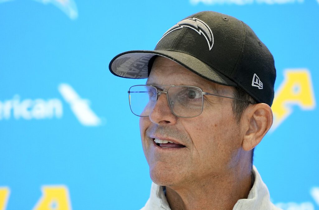 NCAA hands former Michigan coach Jim Harbaugh a 4-year show cause order for recruiting violations