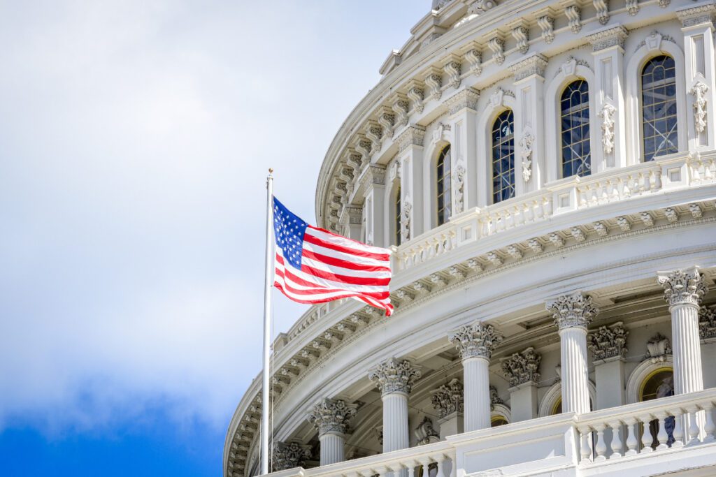 Capitol building in Washington DC with USA flag