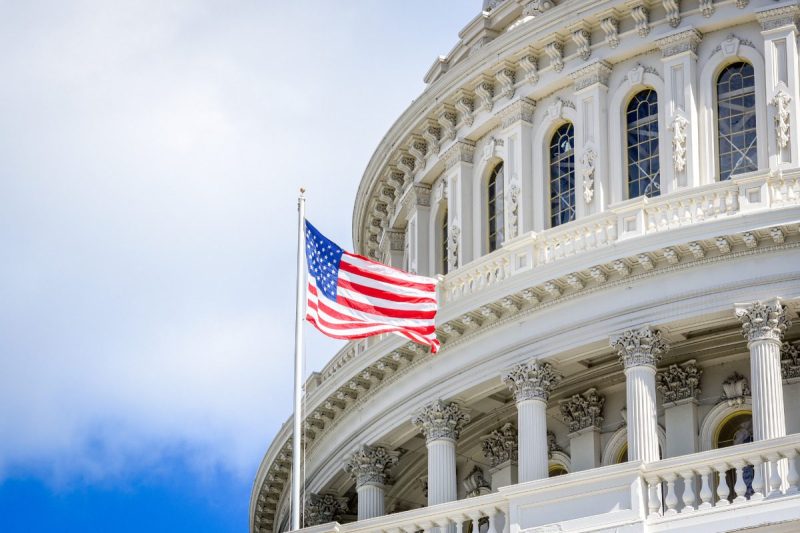 Capitol building in Washington DC with USA flag