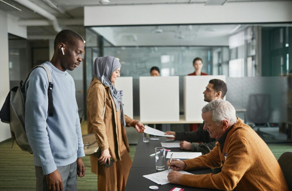 Election workers helping voters.