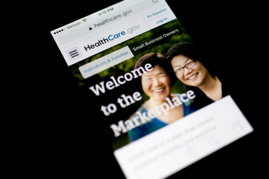 Photo of a phone displaying the ACA Welcome to the Marketplace home screen.