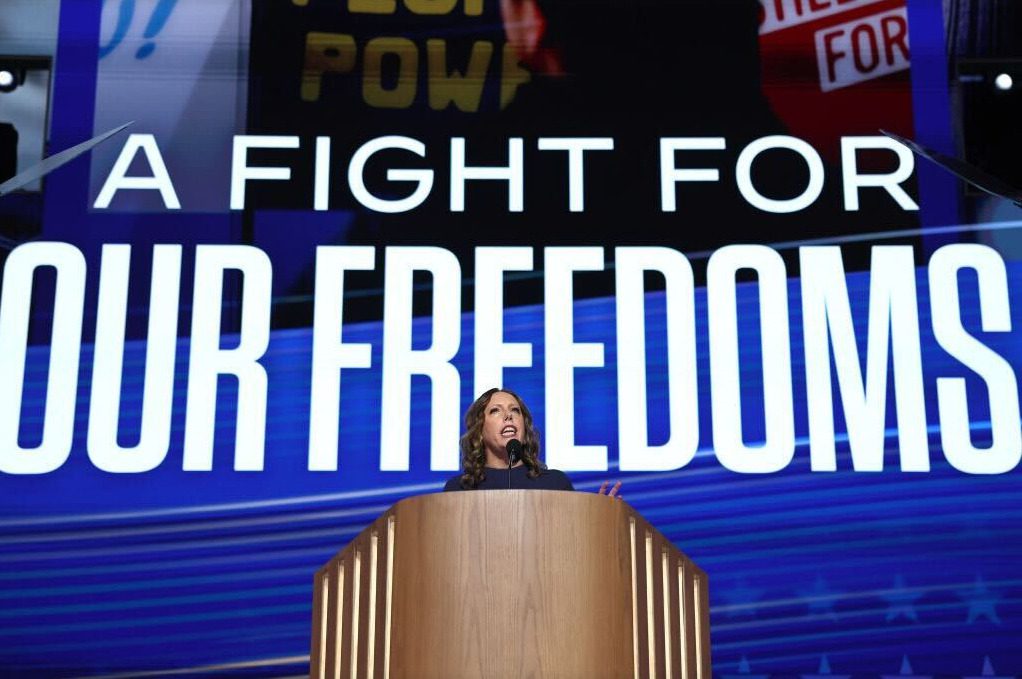 National Abortion Ban Author standing in front of A fight for our freedoms sign.