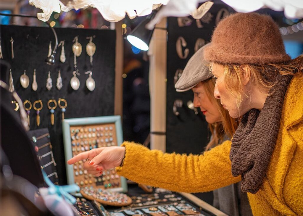 People shopping for jewelry from a small business.