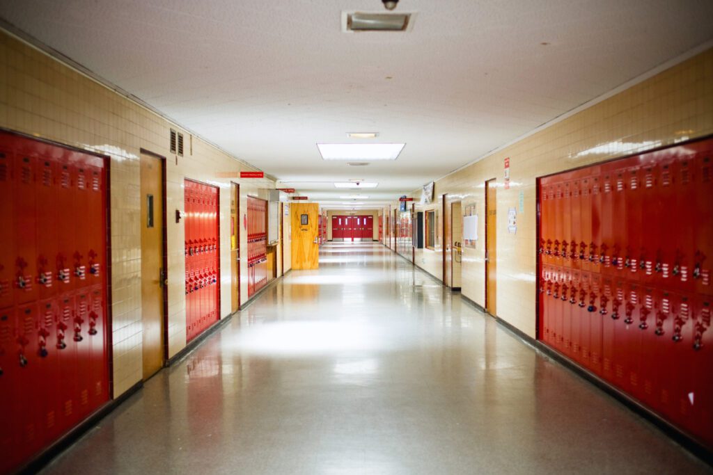 school hallway with red lockers