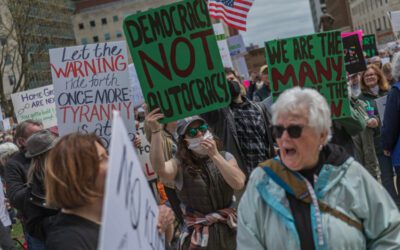 Hundreds march at the Michigan Capitol against Trump policies