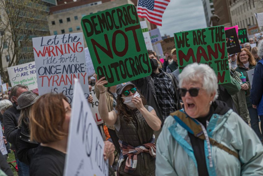 Hundreds march at the Michigan Capitol against Trump policies