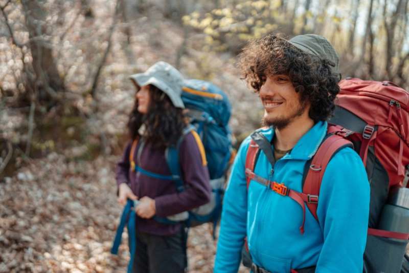 man and woman hiking