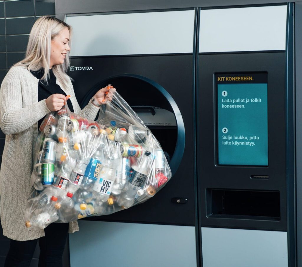 Bottle, can redemption machine allows for dumping whole bag at once