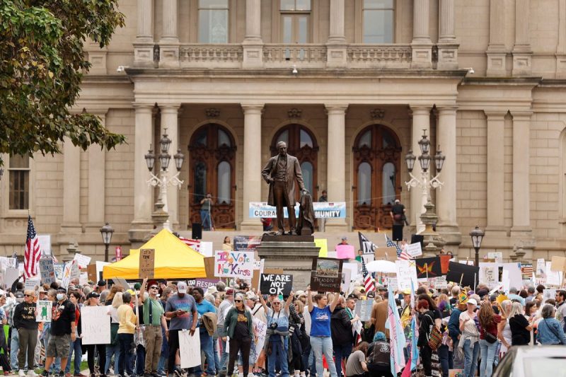 No Kings Protest at Michigan State Capitol. Protesters rally during the "No Kings" national day of protest in Lansing, Michigan, on October 18, 2025. From New York to San Francisco, millions of Americans are expected to hit the streets to voice their anger over President Donald Trump's policies at nationwide "No Kings" protests. (Photo by JEFF KOWALSKY / AFP) (Photo by JEFF KOWALSKY/AFP via Getty Images)