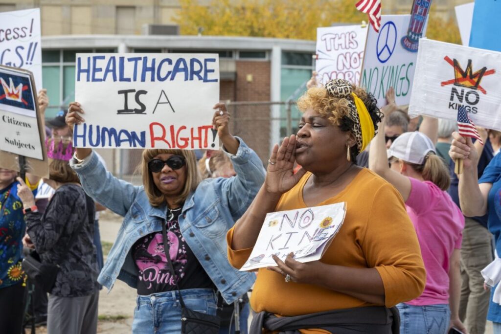Detroit, Michigan USA, 18 October 2025, Protesters from Detroit and Grosse Pointe gathered on the border between their cities for a 'No Kings' rally, protesting President Trump's actions against immigrants and against democratic institutions. (Photo by: Jim West/UCG/Universal Images Group via Getty Images)