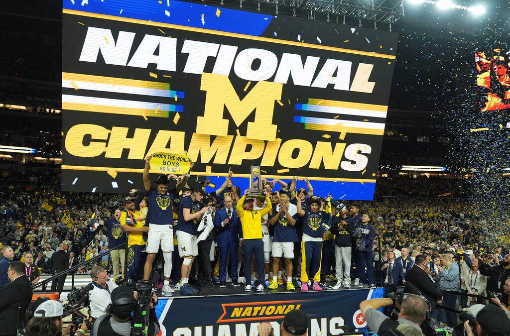 Michigan muscles its way to program’s 2nd national title, beating stubborn UConn 69-63
