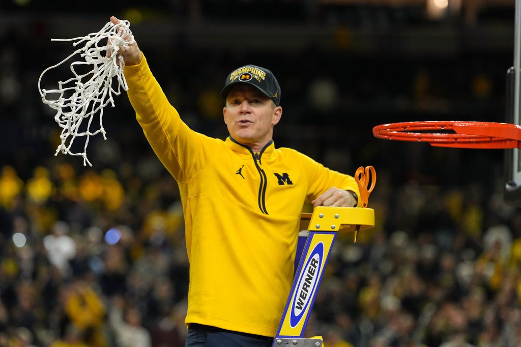 Michigan muscles its way to program's 2nd national title, beating stubborn UConn 69-63