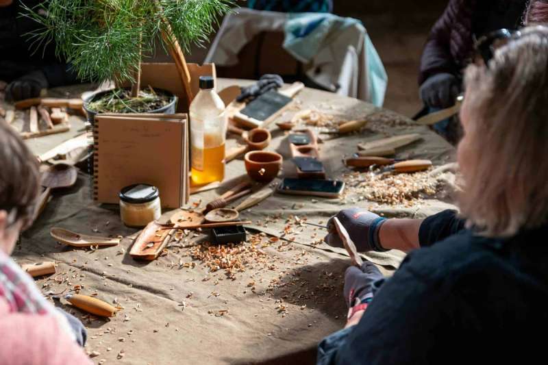 Michigan woodworkers join around a table to work
